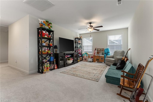 living room featuring carpet floors and ceiling fan