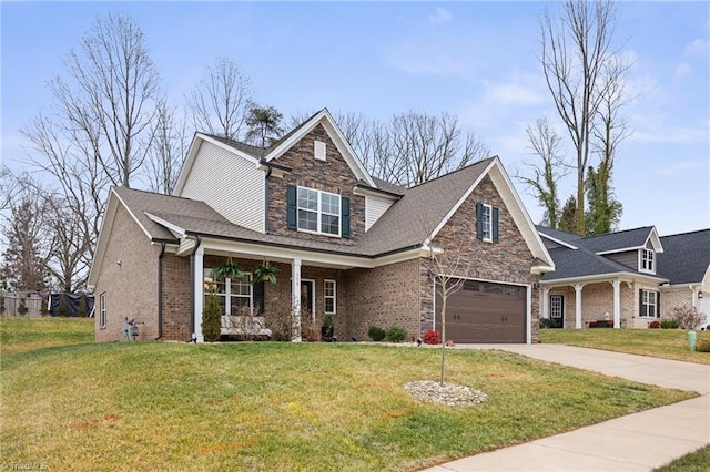 view of front facade featuring a garage, a porch, and a front lawn