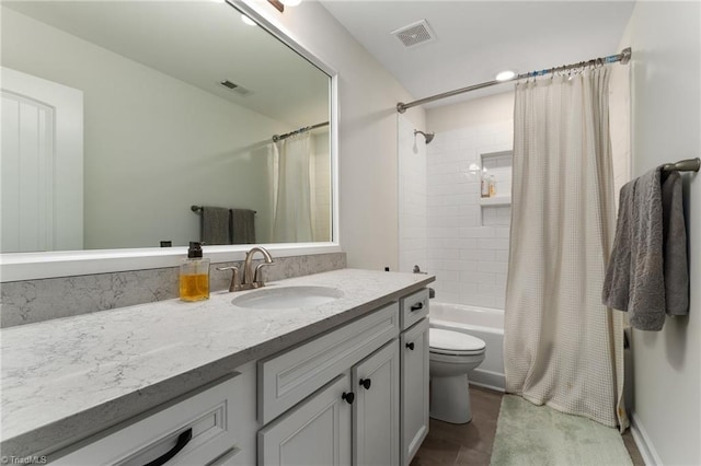 full bathroom featuring vanity, toilet, and shower / bath combo