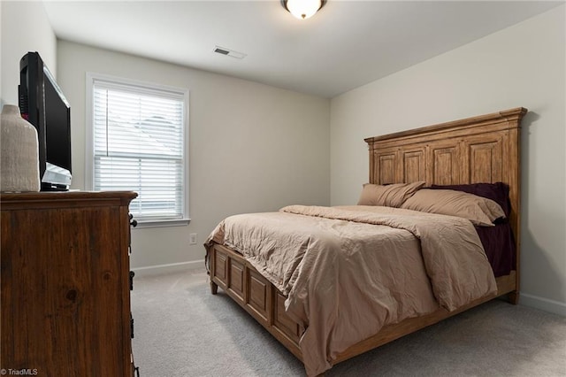 bedroom with light carpet