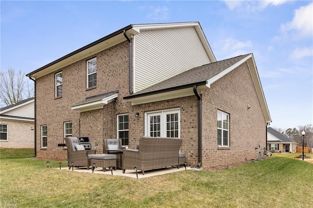 rear view of house with an outdoor hangout area, a patio area, and a lawn