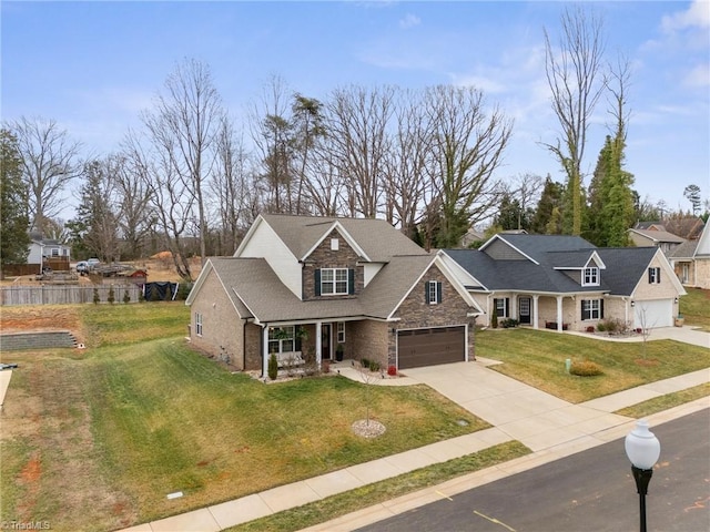 view of front of house featuring a porch, a garage, and a front lawn