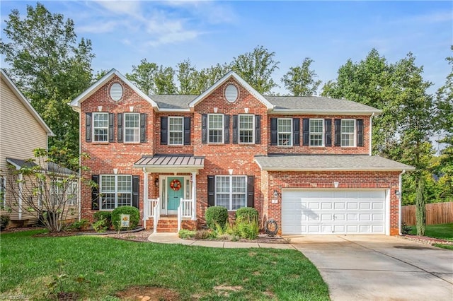 view of front of property with a garage, brick siding, fence, driveway, and a front lawn