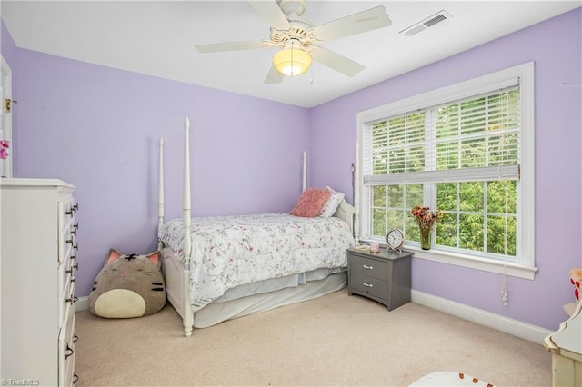 bedroom with carpet floors, visible vents, ceiling fan, and baseboards