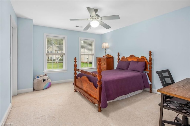 bedroom with visible vents, carpet flooring, a ceiling fan, and baseboards