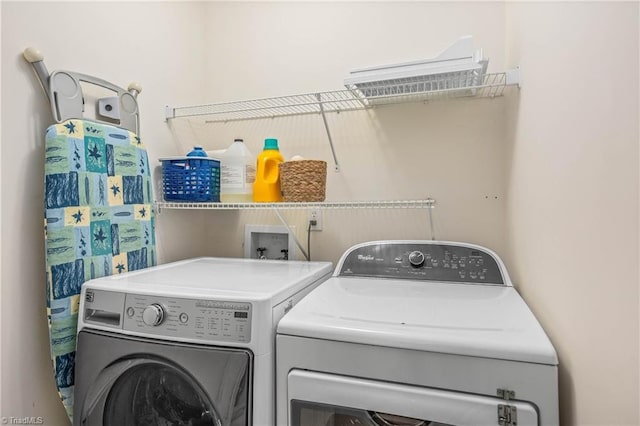 laundry area with washing machine and dryer and laundry area