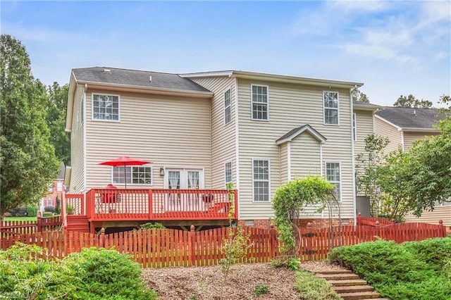 back of house featuring a deck