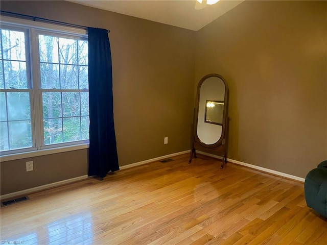 spare room with light wood-type flooring