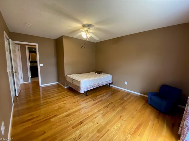 unfurnished bedroom featuring ceiling fan and light wood-type flooring