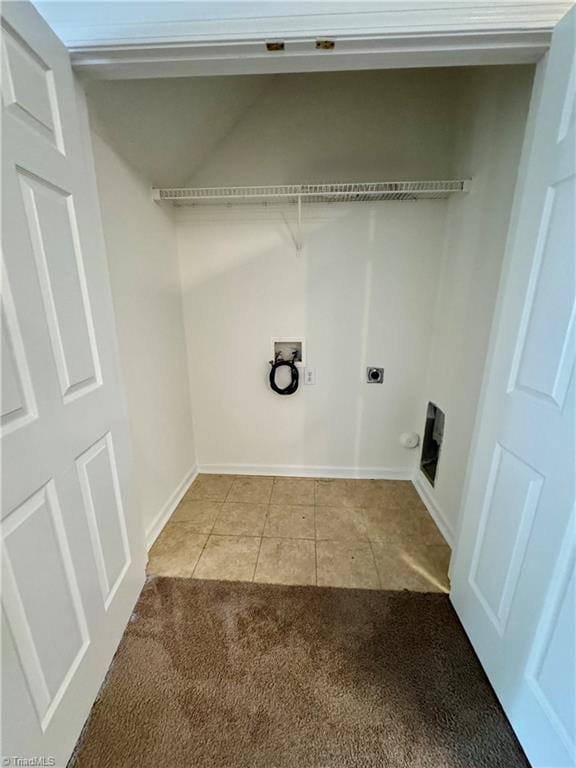 washroom featuring electric dryer hookup, hookup for a washing machine, light tile patterned floors, baseboards, and light carpet