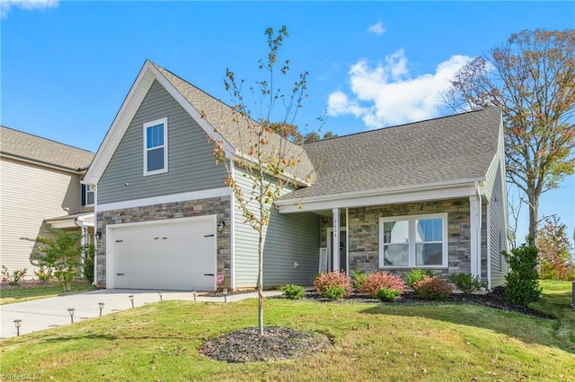 view of front of house featuring a front yard and a garage