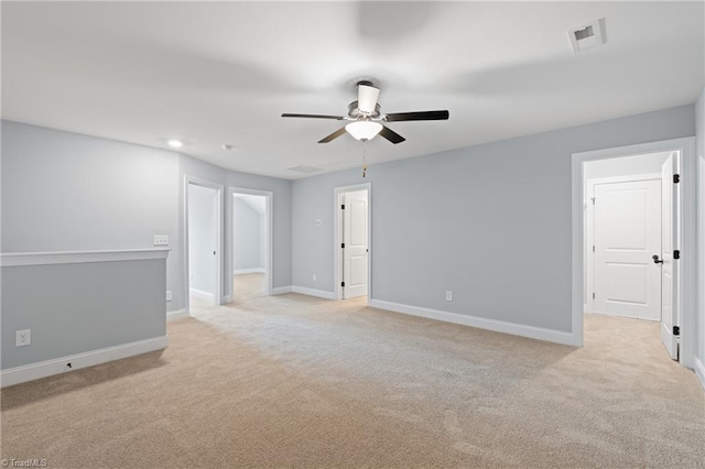 unfurnished room featuring light carpet and ceiling fan