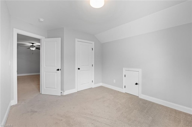 bonus room featuring ceiling fan, light colored carpet, and vaulted ceiling