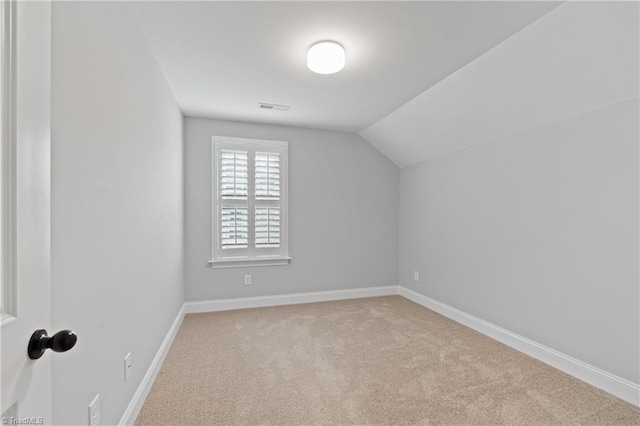 bonus room featuring light carpet and lofted ceiling