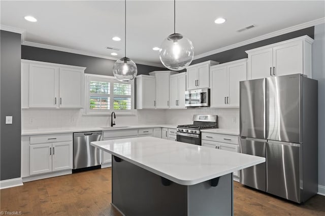 kitchen featuring white cabinets, stainless steel appliances, dark wood-type flooring, and sink