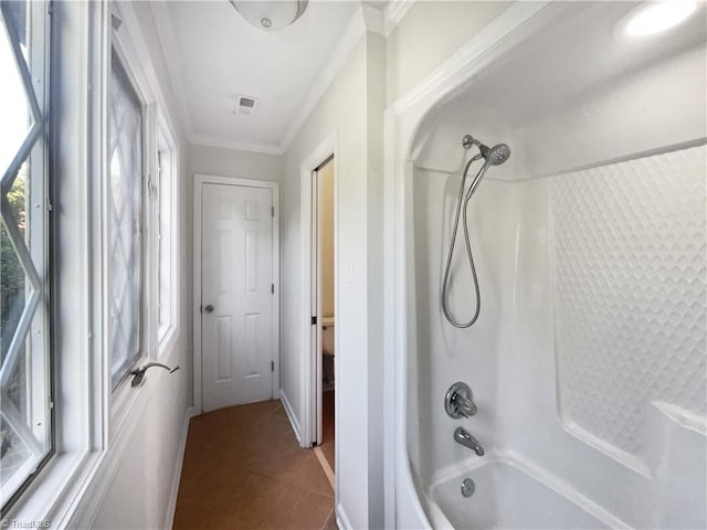 full bath with visible vents, ornamental molding, baseboards, shower / bathing tub combination, and tile patterned floors