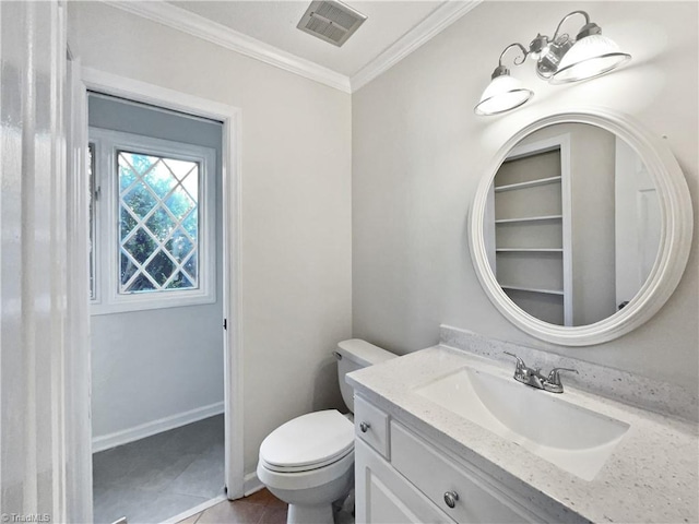 bathroom featuring tile patterned flooring, vanity, toilet, visible vents, and ornamental molding