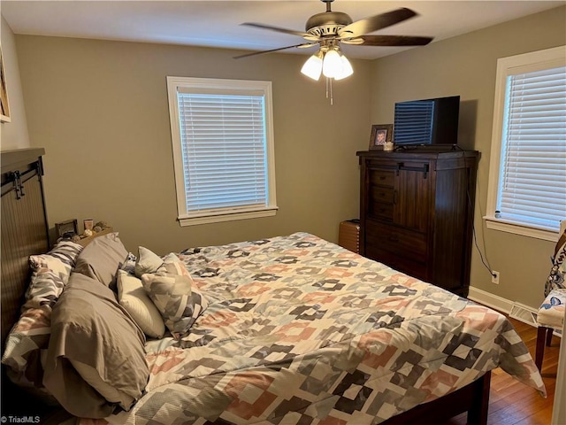 bedroom featuring ceiling fan and hardwood / wood-style flooring