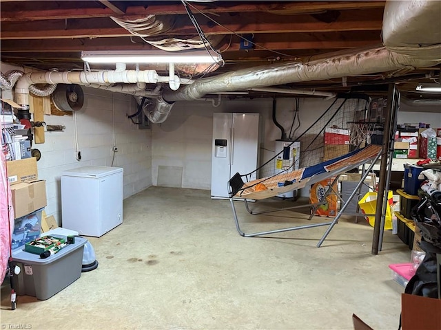 basement with white fridge with ice dispenser, refrigerator, and water heater