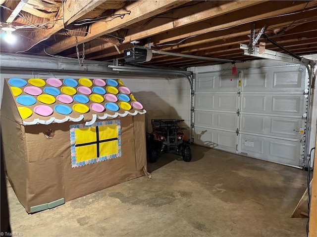 garage featuring a garage door opener