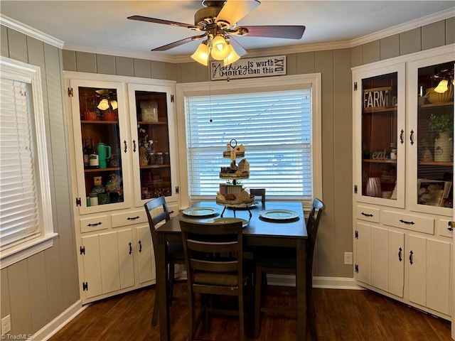 dining area with ceiling fan, dark hardwood / wood-style flooring, and crown molding