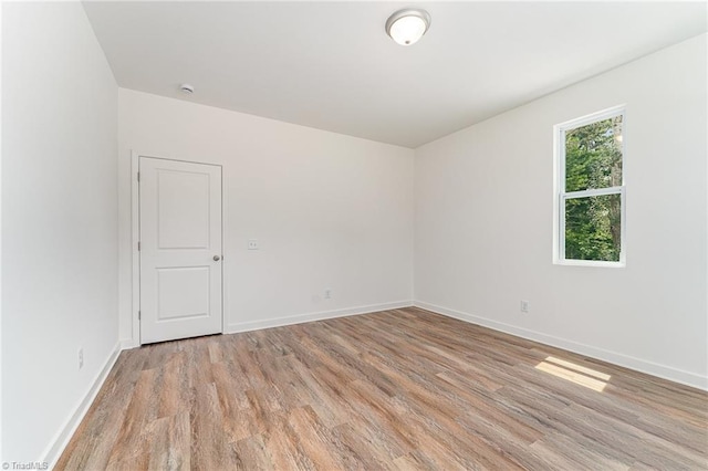 4000 Groometown Rd, Greensboro, NC 27407 - empty room featuring light wood-style floors and baseboards