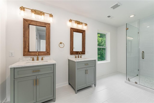 4000 Groometown Rd, Greensboro, NC 27407 - bathroom with two vanities, a shower stall, and recessed lighting
