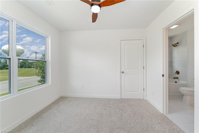 4000 Groometown Rd, Greensboro, NC 27407 - unfurnished bedroom featuring carpet floors, connected bathroom, and ceiling fan