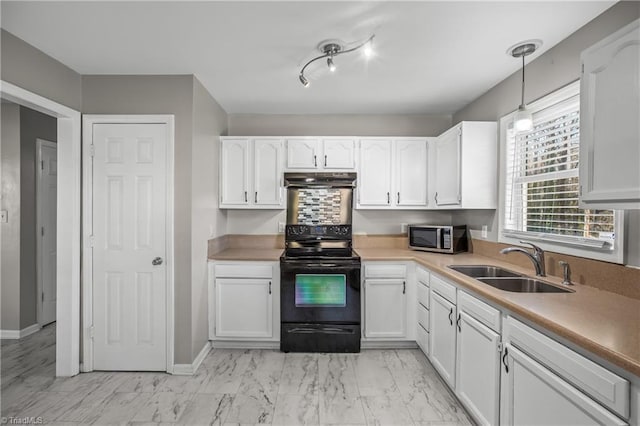 kitchen with white cabinets, stainless steel microwave, marble finish floor, black / electric stove, and a sink