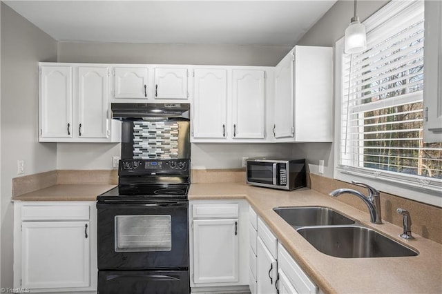 kitchen with black electric range, stainless steel microwave, white cabinets, a sink, and under cabinet range hood