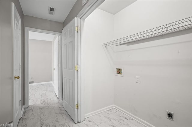 laundry area with visible vents, marble finish floor, electric dryer hookup, and baseboards