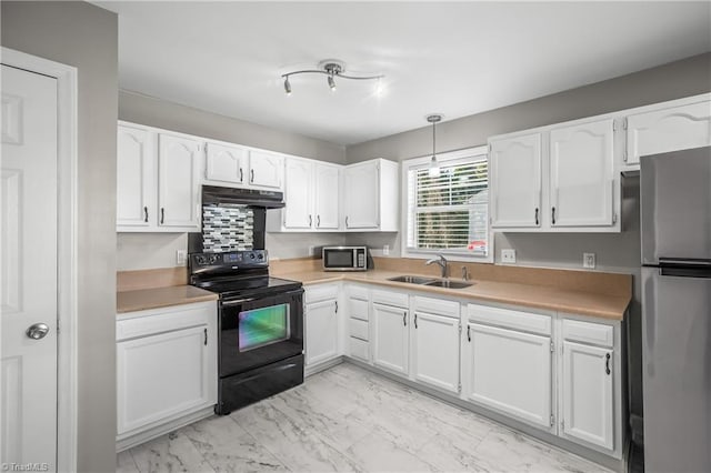 kitchen featuring marble finish floor, appliances with stainless steel finishes, white cabinets, a sink, and under cabinet range hood