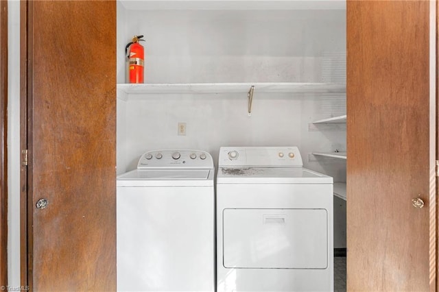 clothes washing area with laundry area and separate washer and dryer