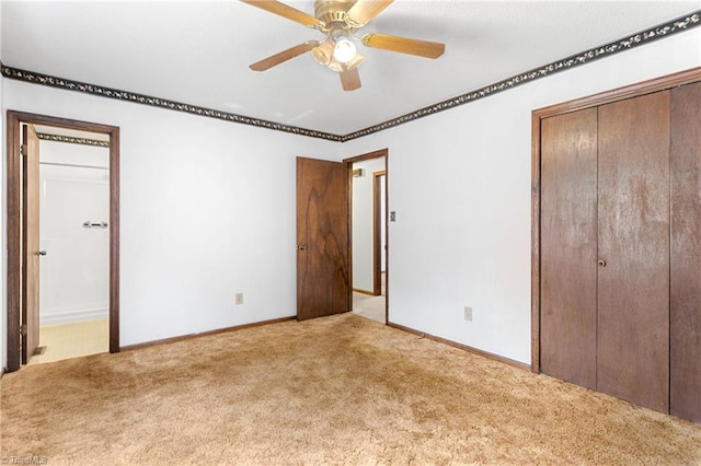 unfurnished bedroom featuring ceiling fan, baseboards, and carpet floors