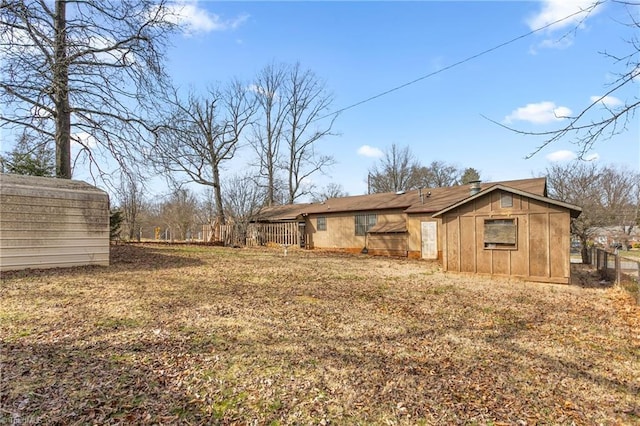 view of side of property featuring a shed and an outdoor structure