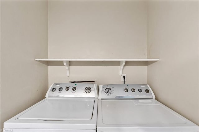 laundry area featuring washing machine and clothes dryer