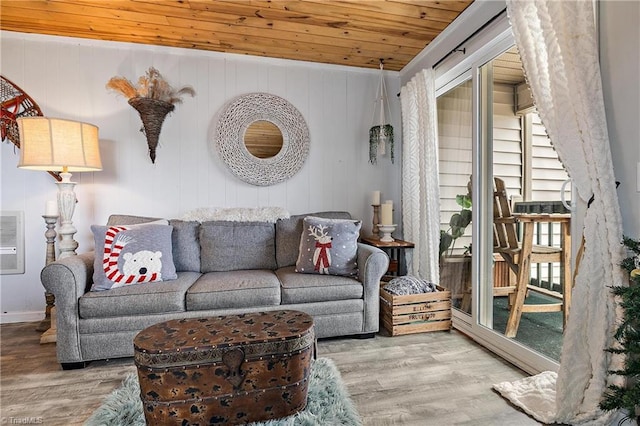 living room featuring light wood-type flooring and wooden ceiling