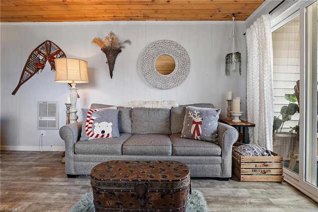 living room with plenty of natural light, heating unit, wood ceiling, and hardwood / wood-style floors