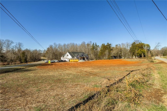 view of yard with a rural view