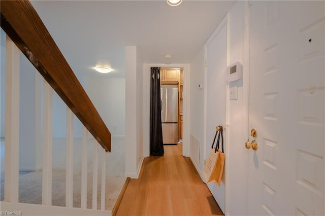 corridor featuring light hardwood / wood-style flooring