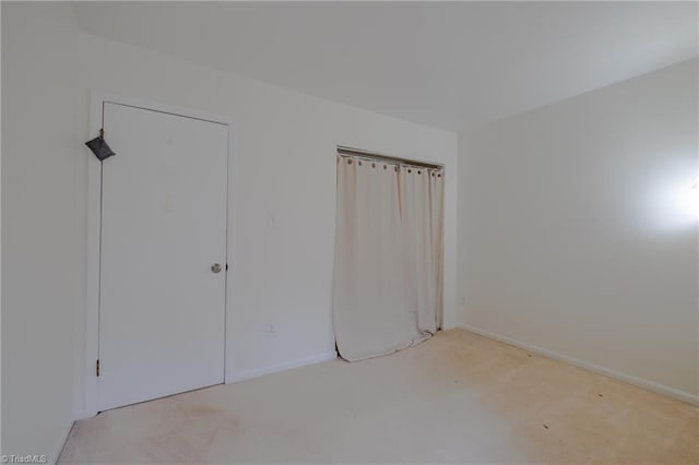 unfurnished bedroom with light carpet