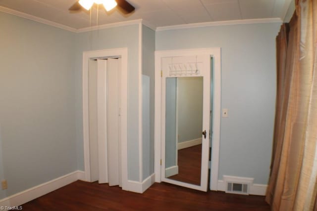 2289 W Pine St, Mount Airy, NC 27030 - unfurnished bedroom featuring dark wood-style flooring, baseboards, crown molding, a closet, and ceiling fan