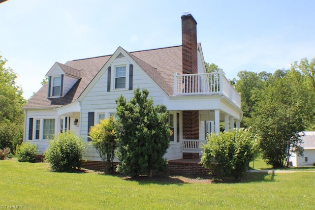 2289 W Pine St, Mount Airy, NC 27030 - view of front facade featuring a balcony, a porch, a front lawn, and roof with shingles