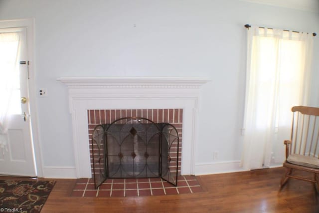 2289 W Pine St, Mount Airy, NC 27030 - detailed view of wood finished floors, a fireplace, and baseboards