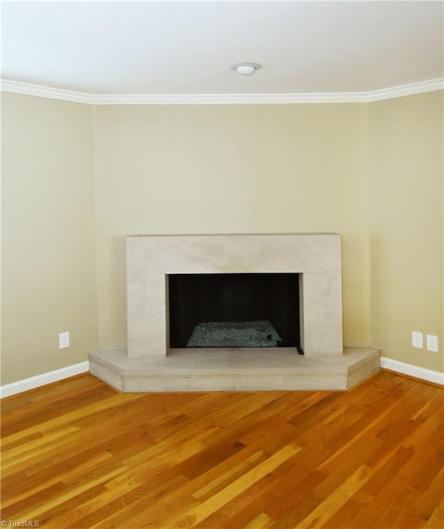 room details featuring ornamental molding and hardwood / wood-style floors