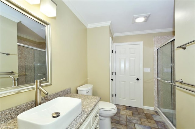 bathroom featuring walk in shower, ornamental molding, vanity, and toilet