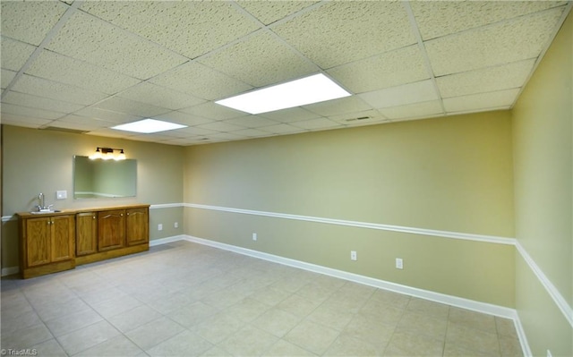 spare room featuring a drop ceiling