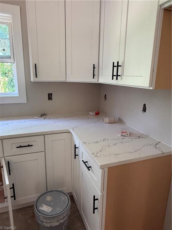 2566 NC Highway 801 S, Advance, NC 27006 - kitchen with light stone counters and white cabinets