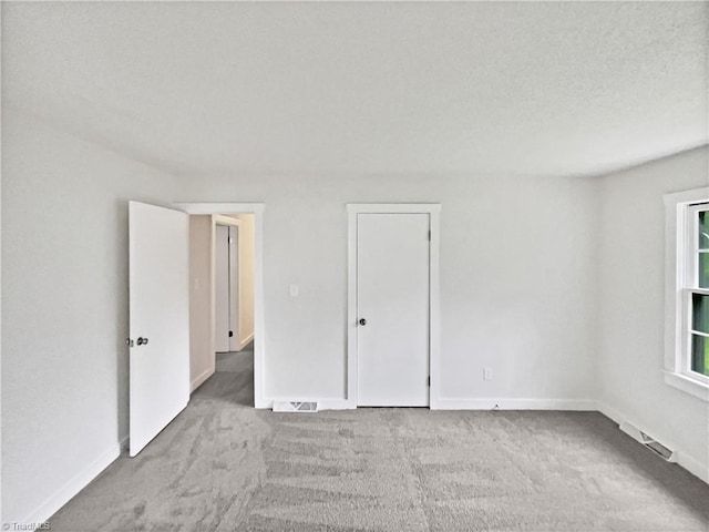 115 Wills Rd, Advance, NC 27006 - unfurnished bedroom with carpet floors and baseboards