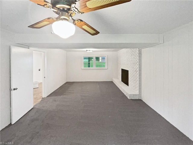 115 Wills Rd, Advance, NC 27006 - unfurnished living room featuring carpet flooring, a brick fireplace, and a ceiling fan